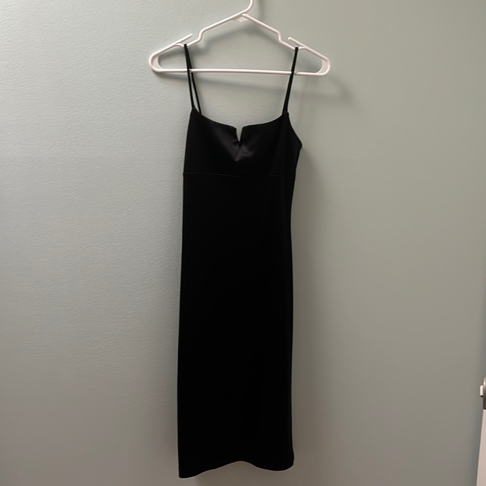 Black spaghetti strap dress with small slit in the back